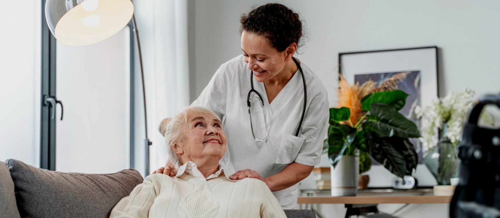 elder man with caregiver outdoors