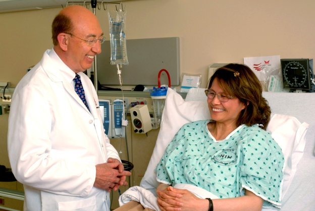 elder woman sitting on wheelchair with caregiver